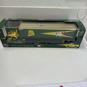 1957 Mack Model N truck and a 1956 Ford F-100 pickup truck